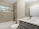 Clean bathroom with gray vanity and a shower/tub combo at 4217 Winfall Ave, North Port, FL 34286