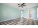 Bedroom with light blue walls and access to bathroom at 525 Madrid Blvd, Punta Gorda, FL 33950