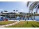 Private dock with two red chairs and peaceful canal views at 525 Madrid Blvd, Punta Gorda, FL 33950