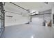 Spacious garage with overhead storage and epoxy flooring at 525 Madrid Blvd, Punta Gorda, FL 33950