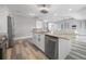 Modern kitchen with white cabinets, granite countertops, and island at 525 Madrid Blvd, Punta Gorda, FL 33950