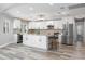 Modern kitchen with white cabinets, granite countertops, and stainless steel appliances at 525 Madrid Blvd, Punta Gorda, FL 33950