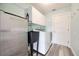 Laundry room with sink, washer, dryer, and extra storage at 525 Madrid Blvd, Punta Gorda, FL 33950