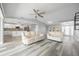 Bright living room with vaulted ceilings and light-colored couches at 525 Madrid Blvd, Punta Gorda, FL 33950