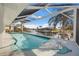 Relaxing pool area with a covered lanai overlooking the canal at 525 Madrid Blvd, Punta Gorda, FL 33950