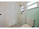 Updated shower with glass enclosure and pebble flooring at 525 Madrid Blvd, Punta Gorda, FL 33950