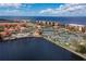 Community overview featuring waterfront property and tennis courts at 87 Vivante Blvd # 8736, Punta Gorda, FL 33950