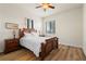 Guest bedroom with full-size bed and wood furniture at 87 Vivante Blvd # 8736, Punta Gorda, FL 33950