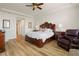 Spacious bedroom with king-size bed and leather recliner at 87 Vivante Blvd # 8736, Punta Gorda, FL 33950