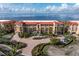Three-story building with waterfront views and lush landscaping at 87 Vivante Blvd # 8736, Punta Gorda, FL 33950