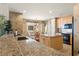 Modern kitchen with granite countertops and island at 87 Vivante Blvd # 8736, Punta Gorda, FL 33950