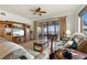 Living room with water views and access to balcony at 87 Vivante Blvd # 8736, Punta Gorda, FL 33950