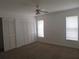 Main bedroom with large closet and neutral carpeting at 1073 Marcus St, Port Charlotte, FL 33952