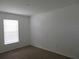 Simple bedroom with neutral wall and carpeting at 1073 Marcus St, Port Charlotte, FL 33952