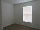 Well-lit bedroom featuring neutral walls and carpet at 1073 Marcus St, Port Charlotte, FL 33952