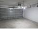 Attached garage with automatic garage door opener and ceiling fan at 1073 Marcus St, Port Charlotte, FL 33952