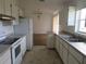 Open kitchen boasting ample counter space and views to living area at 1073 Marcus St, Port Charlotte, FL 33952