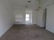 Spacious living room featuring neutral carpeting and ample natural light at 1073 Marcus St, Port Charlotte, FL 33952