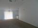 Bright and airy living room with carpet and sliding glass door at 1073 Marcus St, Port Charlotte, FL 33952