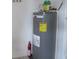 Water heater closet with gas water heater and fire extinguisher at 1073 Marcus St, Port Charlotte, FL 33952