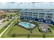 Overhead view of a condo complex, landscaped grounds, a pool and picnic area showing desirable community amenities at 1425 Park Beach Cir # 149, Punta Gorda, FL 33950