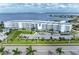 Aerial view of the waterfront community with views of the building's entrance, gardens, and the picturesque bay at 1425 Park Beach Cir # 149, Punta Gorda, FL 33950