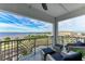 Relax on this balcony overlooking the water with comfortable seating and open railings at 1425 Park Beach Cir # 149, Punta Gorda, FL 33950