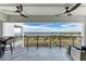 Spacious balcony with outdoor seating and a panoramic view of the bay at 1425 Park Beach Cir # 149, Punta Gorda, FL 33950