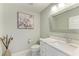 Stylish powder room features elegant vanity, modern fixtures, and tasteful decor, enhancing the home's appeal at 1425 Park Beach Cir # 149, Punta Gorda, FL 33950