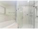 Modern bathroom featuring a glass shower with marble tile and a soaking tub at 1425 Park Beach Cir # 149, Punta Gorda, FL 33950