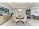 Dining area featuring a round glass table, stylish chairs, decorative lighting, and modern decor at 1425 Park Beach Cir # 149, Punta Gorda, FL 33950