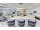 Bright, modern kitchen with quartz countertops, island seating, and stainless steel appliances at 1425 Park Beach Cir # 149, Punta Gorda, FL 33950