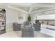 Comfortable sitting room leads to balcony with water views; features stylish chairs and a serene atmosphere at 1425 Park Beach Cir # 149, Punta Gorda, FL 33950