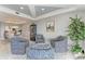 Bright open living and dining space with refined decor and furnishings, leading to an adjacent seating area at 1425 Park Beach Cir # 149, Punta Gorda, FL 33950