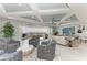Expansive living space with balcony access, plush seating, modern television, and sophisticated decor at 1425 Park Beach Cir # 149, Punta Gorda, FL 33950