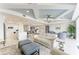 Bright open living area with combined dining and kitchen space, featuring stylish furnishings and modern accents at 1425 Park Beach Cir # 149, Punta Gorda, FL 33950