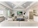 Bright, open-concept living room with modern finishes and stainless steel appliances in the adjacent kitchen at 1425 Park Beach Cir # 149, Punta Gorda, FL 33950