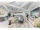 Spacious living room featuring decorative ceilings, water view balcony access, and modern decor at 1425 Park Beach Cir # 149, Punta Gorda, FL 33950