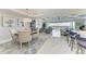 Open-concept living spaces with decorative ceilings, water view balcony, and a dining area at 1425 Park Beach Cir # 149, Punta Gorda, FL 33950