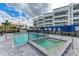 Enjoy the pool and spa with blue building in the background at 1425 Park Beach Cir # 149, Punta Gorda, FL 33950