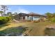 Home exterior showcasing a pool and screened enclosure at 145 Jade St, Rotonda West, FL 33947