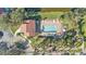 Community pool and clubhouse with surrounding landscape at 15292 Mille Fiore Blvd, Port Charlotte, FL 33953