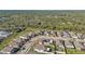 Wide aerial view of a residential neighborhood, showcasing numerous houses and surrounding landscape at 15292 Mille Fiore Blvd, Port Charlotte, FL 33953