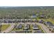 Aerial view of a residential street with houses, neatly lined up, showing neighborhood layout at 15292 Mille Fiore Blvd, Port Charlotte, FL 33953