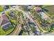 Gated community entrance with pool and palm trees at 15292 Mille Fiore Blvd, Port Charlotte, FL 33953