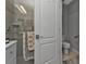 Accessible bathroom with a walk-in shower and grab bars at 15292 Mille Fiore Blvd, Port Charlotte, FL 33953