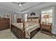 Bright bedroom featuring a comfortable bed and wooden furniture at 15292 Mille Fiore Blvd, Port Charlotte, FL 33953