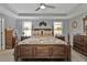 Spacious bedroom with a large wooden bed and plenty of storage at 15292 Mille Fiore Blvd, Port Charlotte, FL 33953