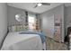 Charming bedroom with white metal bed frame at 15292 Mille Fiore Blvd, Port Charlotte, FL 33953