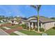 Well-maintained house exterior, landscaping, and driveway at 15292 Mille Fiore Blvd, Port Charlotte, FL 33953